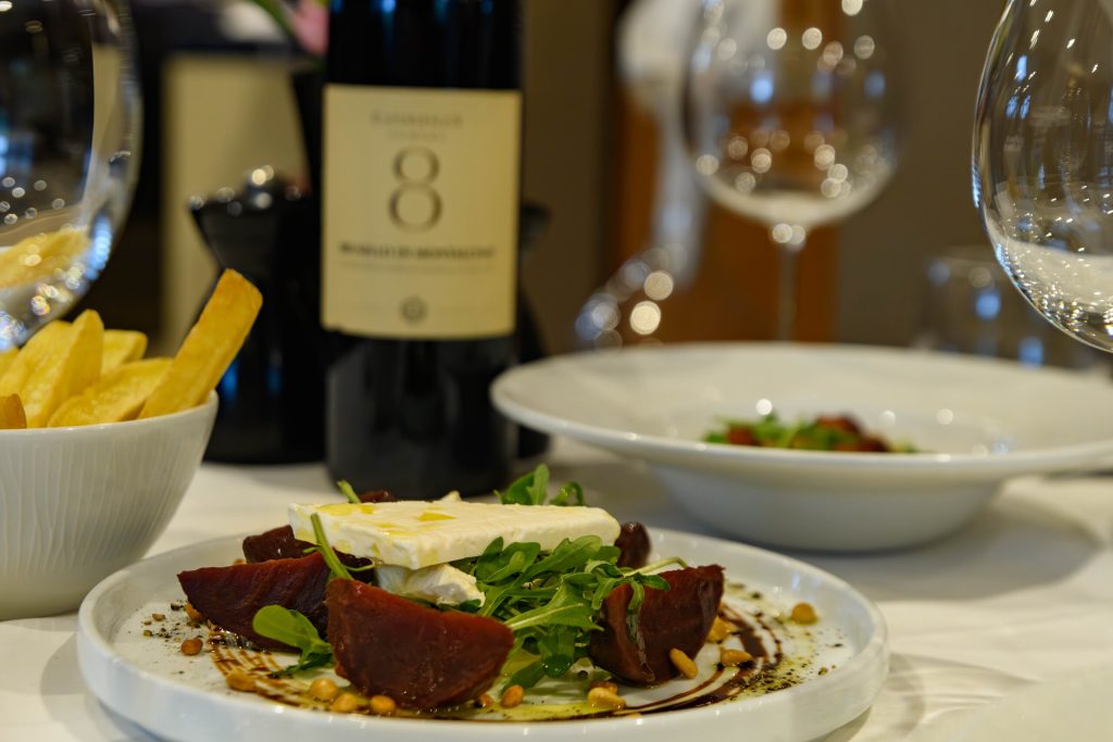 Beetroot and cheese salad served with fries and red wine at The Gables