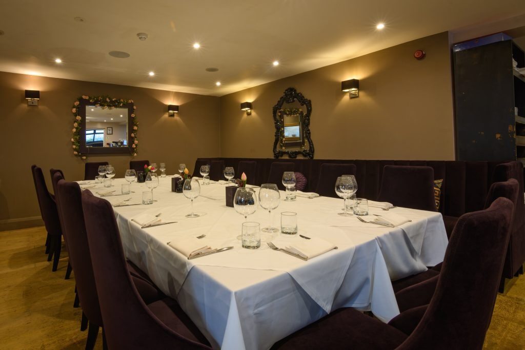 Long dining table set for a private party at The Gables