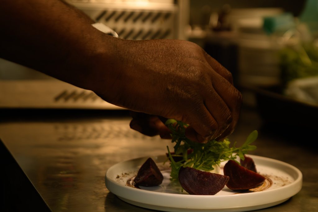 Chef garnishing a beetroot starter at The Gables