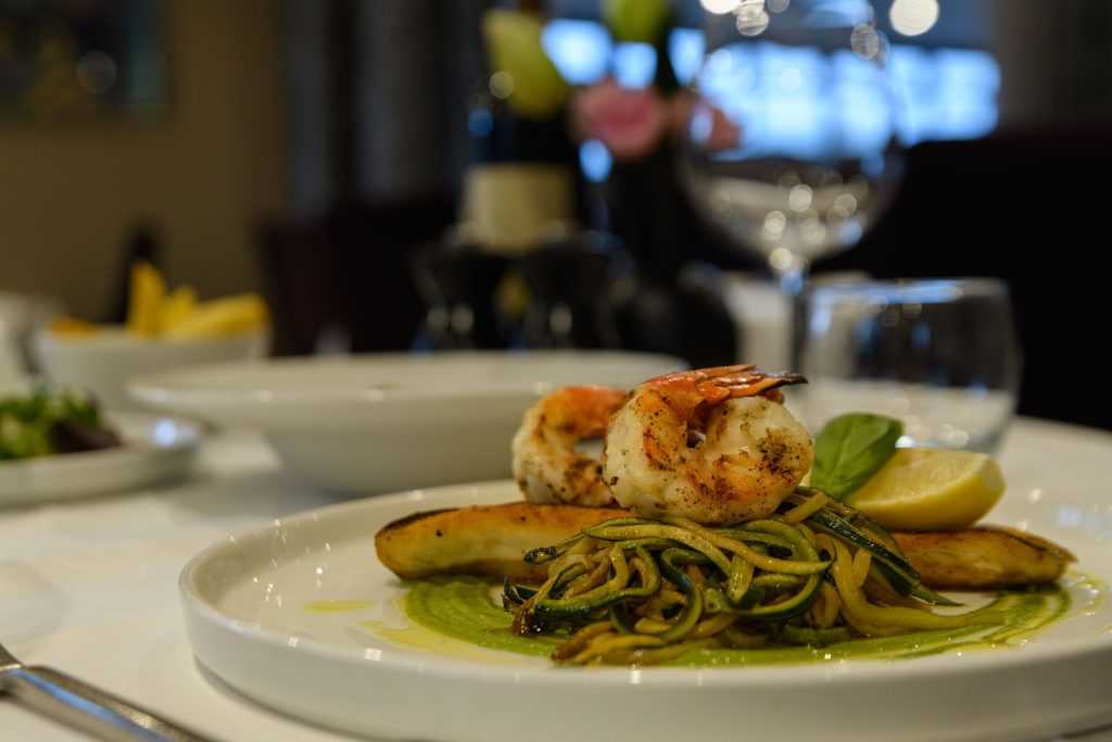 Fillet of sea bass with king prawns and courgette spaghetti at The Gables