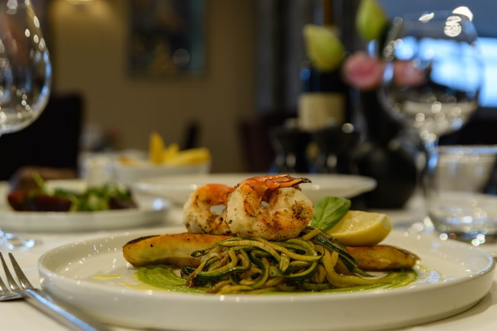 Fillet of sea bass with king prawns and courgette spaghetti at The Gables